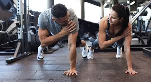 Toning Bingo Wings: Your Ultimate Guide to Sculpting Sleek Arms at the Gym 3 Fitness trainer demonstrating arm toning exercises Tetbury