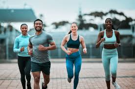 Sculpting Sleek Arms: The Essential Role of Cardio in Toning Without Bulking Up 3 image of people running to incorporate cardio Tetbury exercise into their life to help tone arms and body.